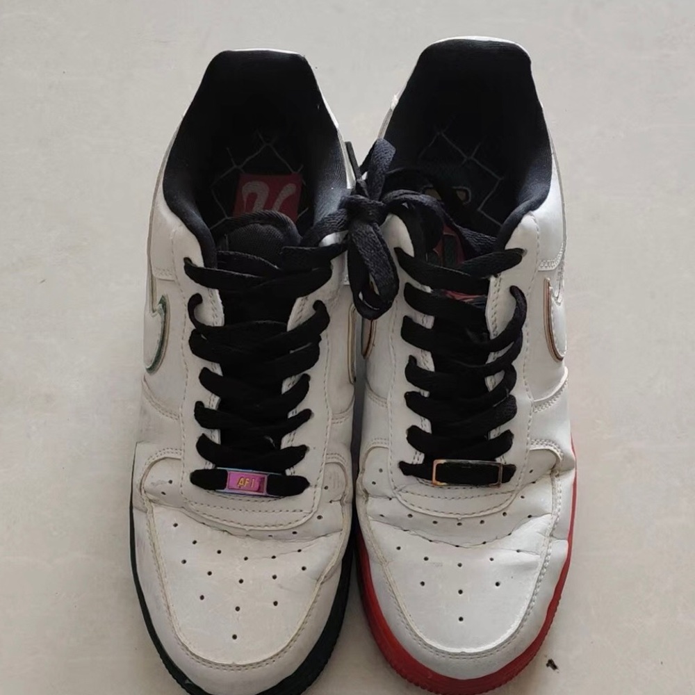 Nike White Low-Top Sneakers with Black Laces and Red & Green Outsoles